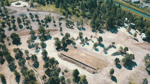 An aerial view of the whole campground showing dirt roads and trees at Soda Creek Campground in Soda Springs, Idaho.